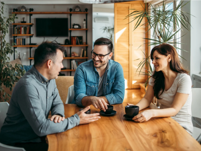 People sitting around a table talking