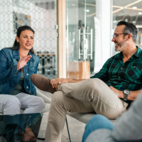 Man and woman sitting in a meeting room