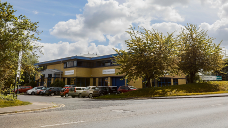 Photo of the outside of the college showing the onsite parking