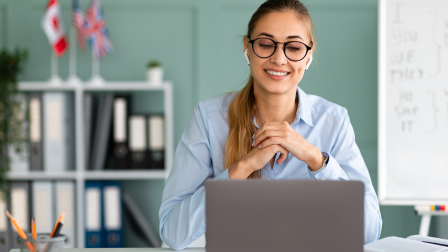 Women on a laptop speaking on a conference call to a tutor